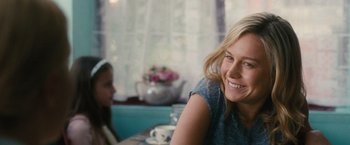 Movie still from “Trainwreck” (2015), directed by Judd Apatow – A woman sitting at a table with a little girl; Close Up shot, Over the shoulder angle