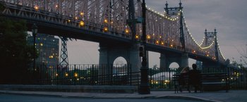 Movie still from “Trainwreck” (2015), directed by Judd Apatow – A view of a bridge from across the street; Extreme Wide shot, Over the shoulder angle