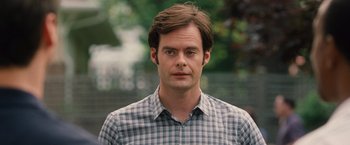 Movie still from “Trainwreck” (2015), directed by Judd Apatow – A person wearing a plaid shirt; Close Up shot, Over the shoulder angle