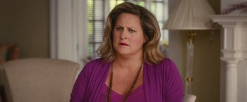 Movie still from “Trainwreck” (2015), directed by Judd Apatow – A person wearing a purple shirt; Close Up shot, Over the shoulder angle