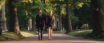 Movie still from “Trainwreck” (2015), directed by Judd Apatow – A man and a woman walking down a street holding hands; Wide shot, Over the shoulder angle