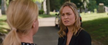 Movie still from “Trainwreck” (2015), directed by Judd Apatow – A woman in black jacket talking to another woman; Close Up shot, Over the shoulder angle