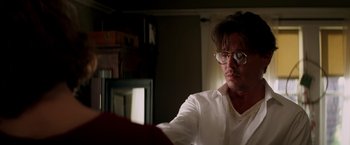 Movie still from “Transcendence” (2014), directed by Wally Pfister – A man in a white dress shirt and glasses; Close Up shot, Low angle