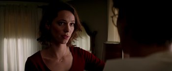 Movie still from “Transcendence” (2014), directed by Wally Pfister – A woman in a red shirt looking at the camera; Close Up shot, Over the shoulder angle