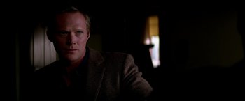 Movie still from “Transcendence” (2014), directed by Wally Pfister – A person wearing a jacket; Close Up shot, Over the shoulder angle