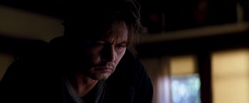 Movie still from “Transcendence” (2014), directed by Wally Pfister – A person looking down at the ground; Close Up shot, High angle