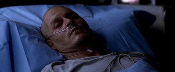 Movie still from “Transcendence” (2014), directed by Wally Pfister – A person laying in a hospital bed; Close Up shot, Overhead angle