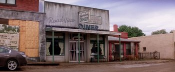 Movie still from “Transcendence” (2014), directed by Wally Pfister – An old fashioned diner is on the side of the road; Wide shot, High angle