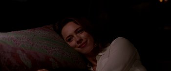 Movie still from “Transcendence” (2014), directed by Wally Pfister – A woman is laying on a pillow in the dark; Close Up shot, Low angle