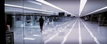 Movie still from “Transcendence” (2014), directed by Wally Pfister – Two people are walking in a hallway of mirrors; Extreme Wide shot, High angle