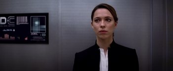 Movie still from “Transcendence” (2014), directed by Wally Pfister – A woman wearing a black jacket and a white shirt; Close Up shot, Low angle