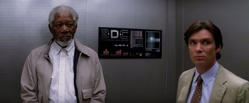 Movie still from “Transcendence” (2014), directed by Wally Pfister – A man standing in front of an elevator; Medium shot, Low angle