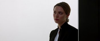 Movie still from “Transcendence” (2014), directed by Wally Pfister – A woman in a black jacket looking at the camera; Close Up shot, Low angle