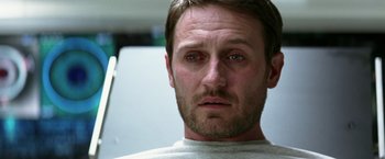 Movie still from “Transcendence” (2014), directed by Wally Pfister – A man's face in a white shirt; Close Up shot, Low angle