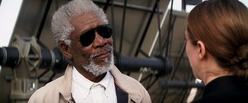 Movie still from “Transcendence” (2014), directed by Wally Pfister – An older man wearing sunglasses and a jacket; Close Up shot, Low angle