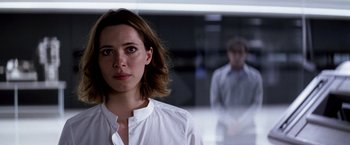 Movie still from “Transcendence” (2014), directed by Wally Pfister – A woman in a white shirt and a man in a white shirt; Close Up shot, Over the shoulder angle