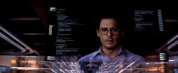 Movie still from “Transcendence” (2014), directed by Wally Pfister – A man with glasses is looking at a computer screen; Close Up shot, Over the shoulder angle
