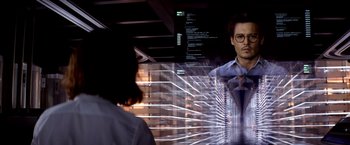 Movie still from “Transcendence” (2014), directed by Wally Pfister – A woman looking at a man in a mirror; Medium shot, Over the shoulder angle