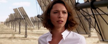 Movie still from “Transcendence” (2014), directed by Wally Pfister – A person wearing a white shirt; Close Up shot, Over the shoulder angle