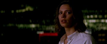 Movie still from “Transcendence” (2014), directed by Wally Pfister – A person wearing a white shirt; Close Up shot, Low angle