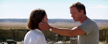 Movie still from “Transcendence” (2014), directed by Wally Pfister – A man touching a woman's face with his hand; Close Up shot, Over the shoulder angle