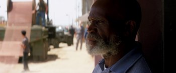 Movie still from “Transcendence” (2014), directed by Wally Pfister – An older man with a beard and a mustache; Close Up shot, Over the shoulder angle