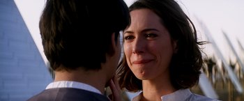 Movie still from “Transcendence” (2014), directed by Wally Pfister – A person with her face close to the face of another person; Close Up shot, Over the shoulder angle