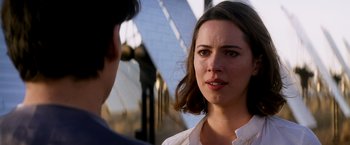 Movie still from “Transcendence” (2014), directed by Wally Pfister – A woman is talking to a man in front of a building; Close Up shot, Over the shoulder angle