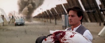 Movie still from “Transcendence” (2014), directed by Wally Pfister – A man with blood all over his face and chest; Close Up shot, Low angle