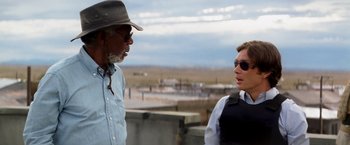 Movie still from “Transcendence” (2014), directed by Wally Pfister – A man and a woman talking to each other outside; Medium shot, Over the shoulder angle