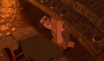 Movie still from “Treasure Planet” (2002), directed by John Musker – An animated picture of a man sitting on the floor; Medium shot, Overhead angle