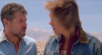 Movie still from “Tremors” (1990), directed by Ron Underwood – A man and a woman talking to each other; Close Up shot, Over the shoulder angle