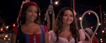 Movie still from “Trick 'r Treat” (2007), directed by Michael Dougherty – Two women dressed up as snow white and the evil queen; Close Up shot, Over the shoulder angle