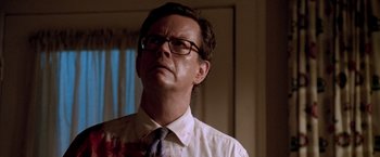 Movie still from “Trick 'r Treat” (2007), directed by Michael Dougherty – A man in a white dress shirt and a tie; Close Up shot, Low angle