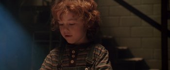 Movie still from “Trick 'r Treat” (2007), directed by Michael Dougherty – A little boy that is looking down at something; Close Up shot, High angle