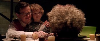 Movie still from “Trick 'r Treat” (2007), directed by Michael Dougherty – A man and a boy sitting at a dinner table; Close Up shot, Over the shoulder angle