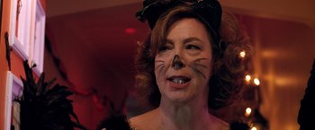 Movie still from “Trick 'r Treat” (2007), directed by Michael Dougherty – A person wearing a cat costume; Close Up shot, Low angle