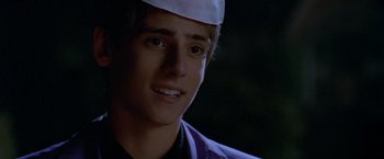 Movie still from “Trick 'r Treat” (2007), directed by Michael Dougherty – A person wearing a hat; Close Up shot, Over the shoulder angle