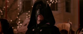 Movie still from “Trick 'r Treat” (2007), directed by Michael Dougherty – A man with a black mask on his face; Close Up shot, Low angle
