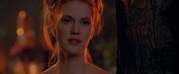 Movie still from “Trick 'r Treat” (2007), directed by Michael Dougherty – A beautiful young woman with red hair wearing a tiara; Close Up shot, Over the shoulder angle