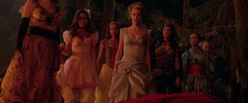 Movie still from “Trick 'r Treat” (2007), directed by Michael Dougherty – A group of women in costumes standing next to each other; Wide shot, Low angle