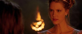 Movie still from “Trick 'r Treat” (2007), directed by Michael Dougherty – A beautiful young lady standing in front of a candle; Close Up shot, Over the shoulder angle