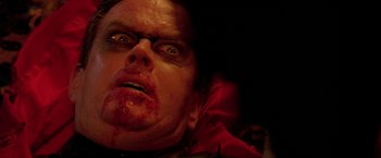 Movie still from “Trick 'r Treat” (2007), directed by Michael Dougherty – A person with blood on his face; Close Up shot, Overhead angle