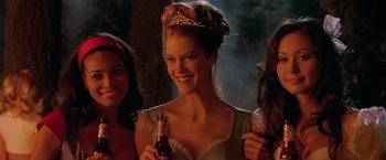 Movie still from “Trick 'r Treat” (2007), directed by Michael Dougherty – A woman holding a beer in her hand; Medium shot, Low angle