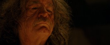 Movie still from “Trick 'r Treat” (2007), directed by Michael Dougherty – An old man with long grey hair and a beard; Close Up shot, Low angle
