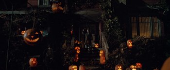 Movie still from “Trick 'r Treat” (2007), directed by Michael Dougherty – Many pumpkins on the steps of the house; Extreme Wide shot, High angle