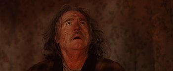 Movie still from “Trick 'r Treat” (2007), directed by Michael Dougherty – An old man with long hair looking up at the sky; Close Up shot, Low angle