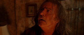 Movie still from “Trick 'r Treat” (2007), directed by Michael Dougherty – An older man with long hair and a beard; Close Up shot, Low angle