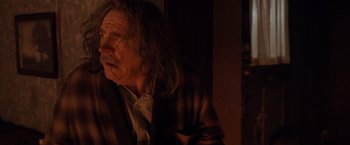 Movie still from “Trick 'r Treat” (2007), directed by Michael Dougherty – An old man with long hair is looking into the distance; Close Up shot, Over the shoulder angle