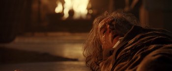 Movie still from “Trick 'r Treat” (2007), directed by Michael Dougherty – An old man with long hair is looking up; Close Up shot, Over the shoulder angle